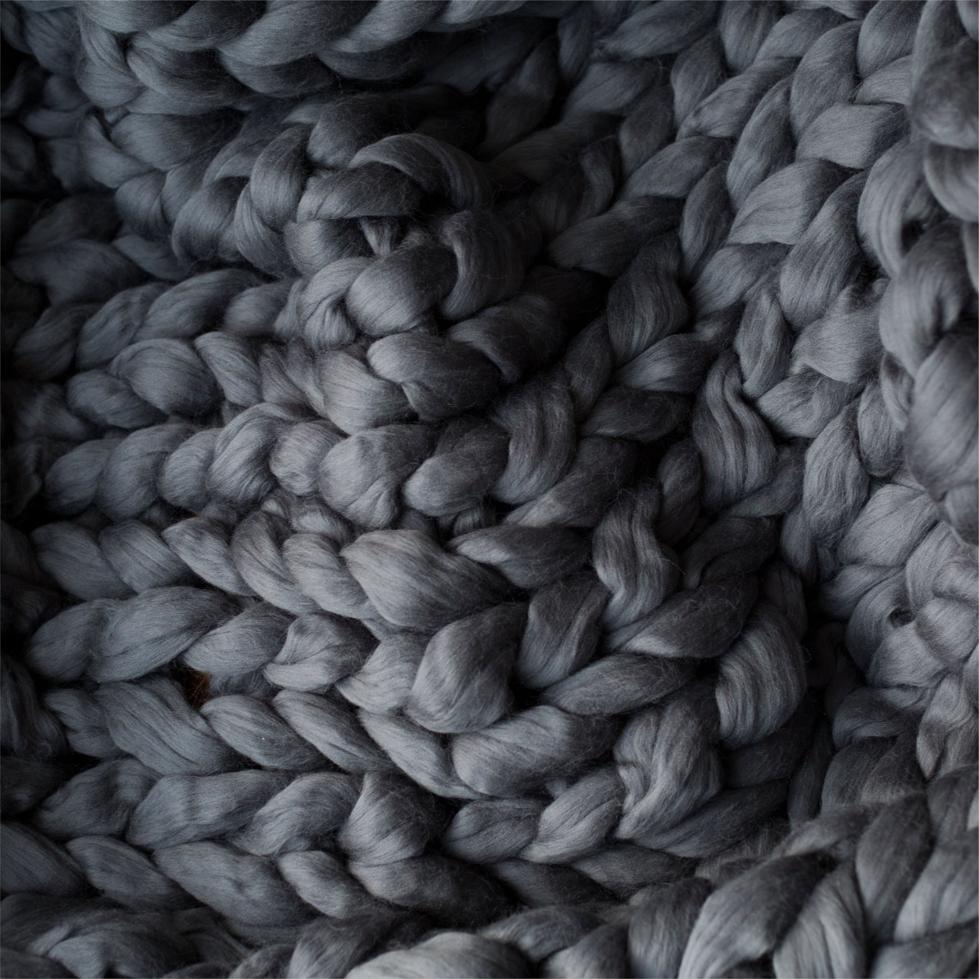 close-up gray chunky knitted blanket throw merino wool